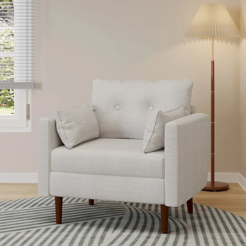 Fauteuil club capitonné avec coussins décoratifs