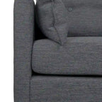 Fauteuil club capitonné avec coussins décoratifs