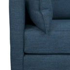 Fauteuil club capitonné avec coussins décoratifs